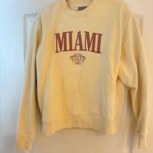 Kith MIAMI Crewneck Sweatshirt in Pale Yellow with Maroon Graphic